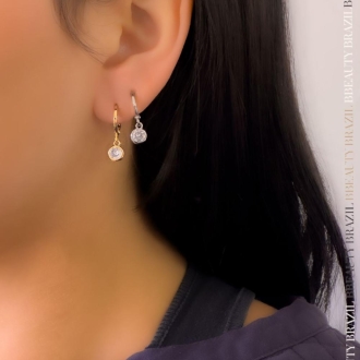 Detalhes do produto Brinco argola articulada com uma zirconia, em rodio branco