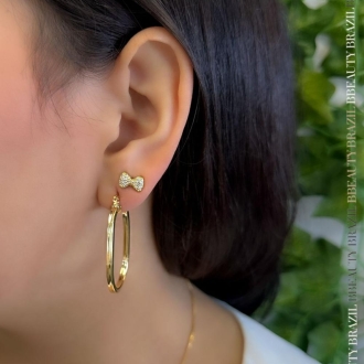 Detalhes do produto Brinco Argola Oval tubo quadrado 2mm, em ouro.