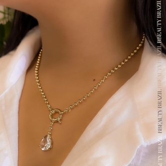 Detalhes do produto Colar bolinhas com um Cristal em gota, em ouro.